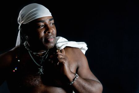 sympathetic cuban man with white jacket over shoulder の写真素材