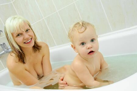 mother and her son in the bathroomの写真素材