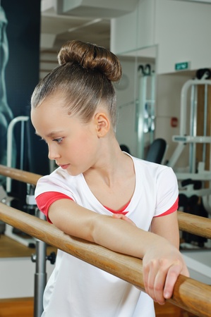 portrait of young beauty gymnast in gymnasiumの写真素材
