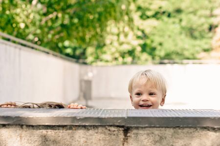 playing little girl and boy in the parkの写真素材