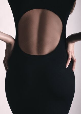 low neck in black dress of womanの写真素材