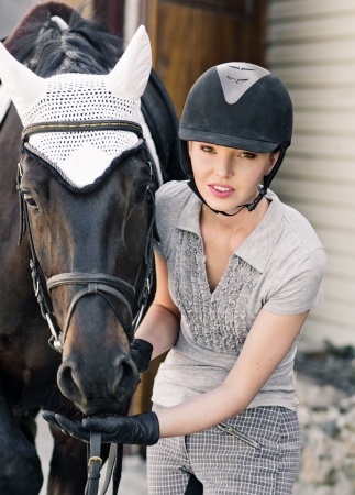 portrait woman with horse on hazel backgroundの写真素材
