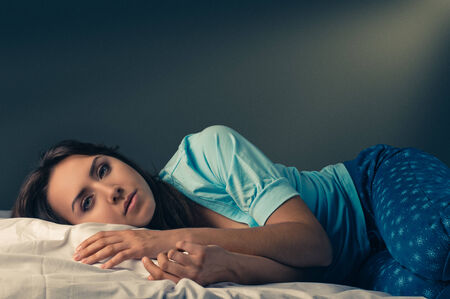young woman on bed in the room