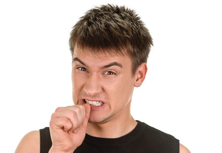 young man showing negative sign on white background