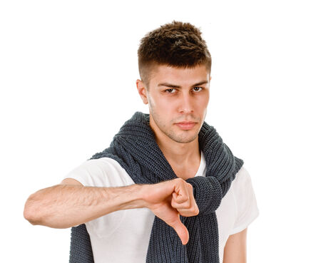 young man showing negative sign on white background