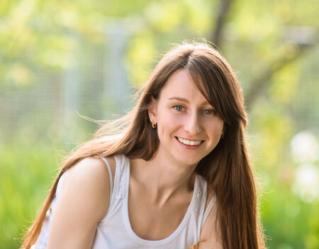 Portrait Of Young Smiling Beautiful Woman. outdoor