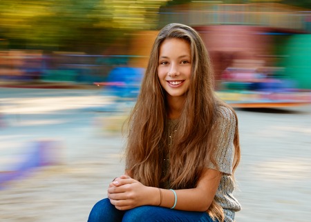 Beautiful girl in autumn. background with natural motion blurの写真素材