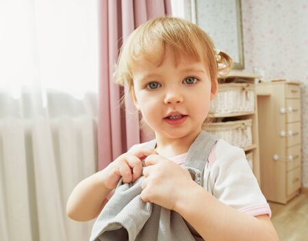 Girl playing in the room, portrait homeの写真素材