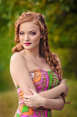 Portrait of a beautiful red-haired young woman summer outdoors. fashion  strollの写真素材