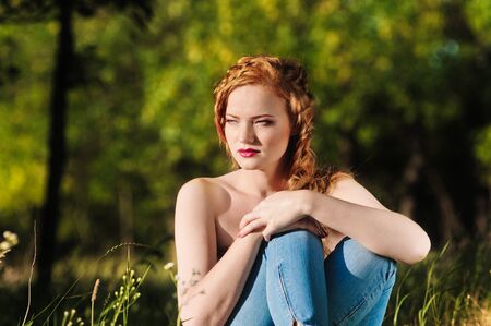 Portrait of a beautiful red-haired young woman summer outdoors. fashion  strollの写真素材