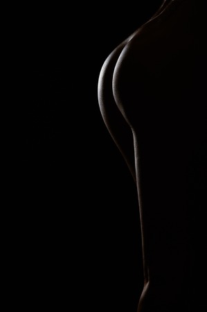 Sexy body nude woman circuit with hotspot on black backgroundの写真素材