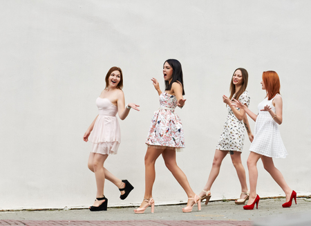 Group Of Women Walking On City Street about light wallの写真素材
