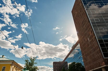 The wires for trolley buses with sky and building. shot from below. Moscow Russiaの写真素材