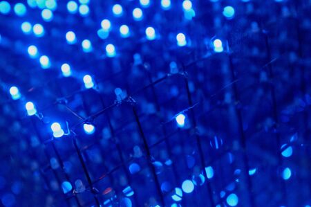 LED background with dozens transparent blue LEDsの写真素材