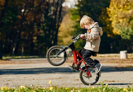 boy Biker jumping outdoor autumn park. Sofia Bulgariaの写真素材
