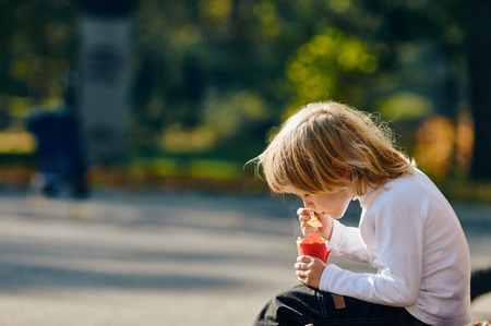 child boy eating corn from cup. National Foods in Bulgariaの写真素材
