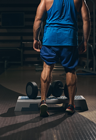 Training calf muscles with dumbbellsの写真素材