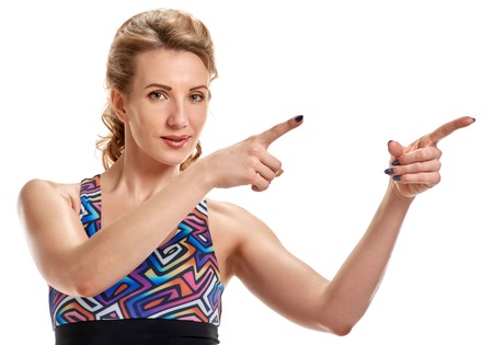Attractive sportswoman pointingの写真素材