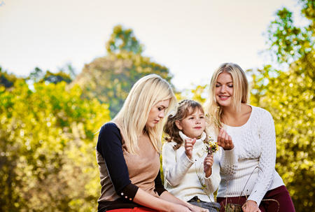 Happy smiling sisters outdoorの写真素材