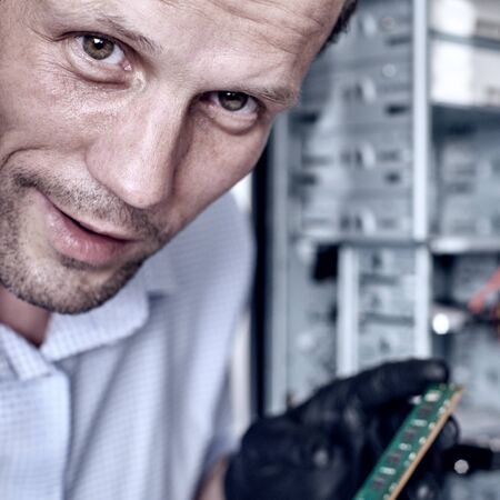 Engineer repairing computer