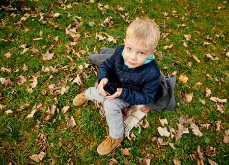 Boy sitting on the grass