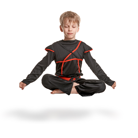 Young ninja meditatingの写真素材