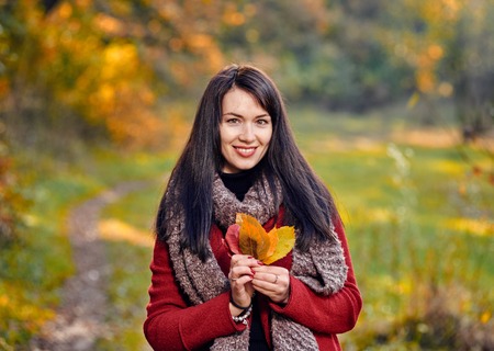 Woman with bouquet of leaves