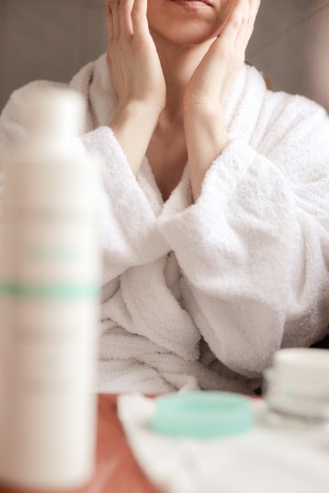 Woman applying creamの写真素材