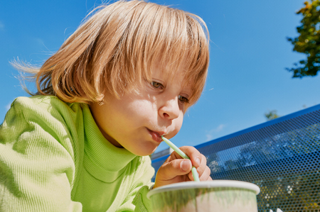 Little boy with juiceの写真素材