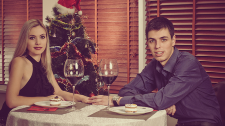 Young happy family celebrating Christmas and having funの写真素材