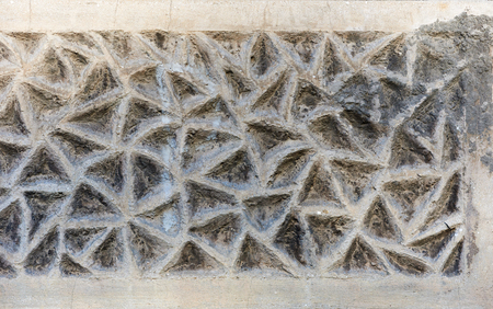 Closeup of asymmetry pattern on stone wall for background textureの写真素材