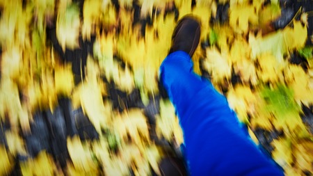 Man shoes walking on leaves outdoor