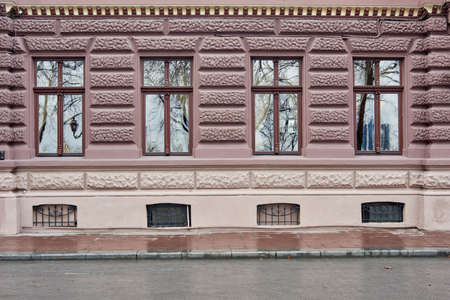 Architectural elements of modern building facade with glass windows