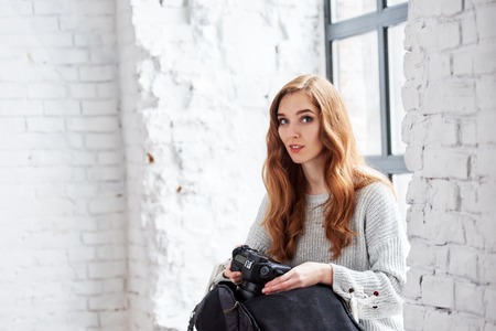 Female photographer with cameraの写真素材