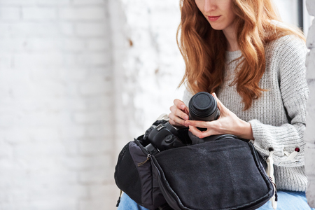 Photographer holding lensの写真素材