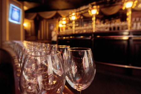 Wineglasses in row on barの写真素材