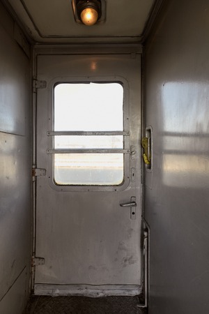 Closeup photo of iron platform interior in railway carriageの写真素材