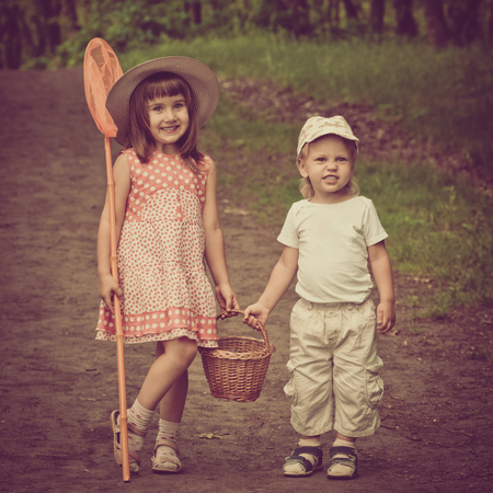 Funny kids in the forestの写真素材