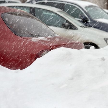 Parked cars on snowstormの写真素材
