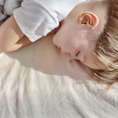 Child sleeping at homeの写真素材