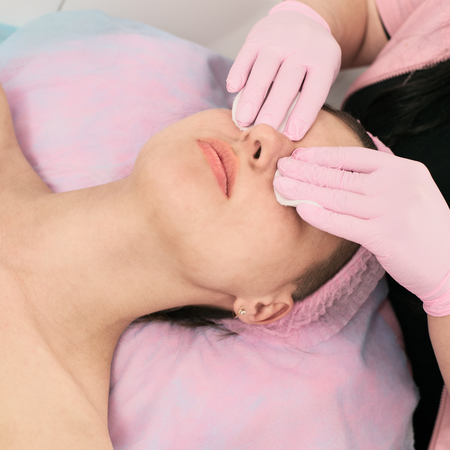 Woman cleaning faceの写真素材