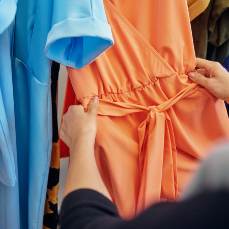 Fashion designer with dressの写真素材