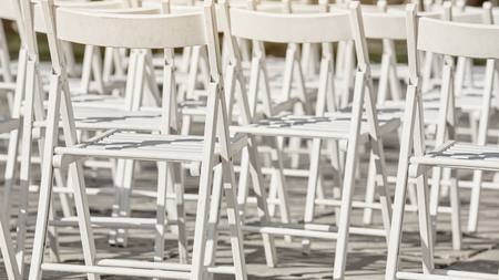 Rows of white chairsの写真素材