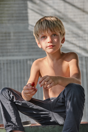 Cute blond boy restingの写真素材