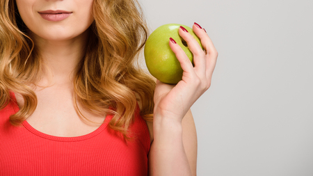 close up Woman holding appleの写真素材