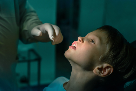 boy and Dentists hand