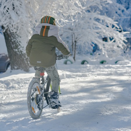Young cyclist on winterの写真素材