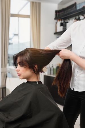 Doing new hairstyleの写真素材