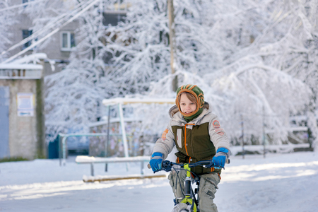 Riding bike on snowの写真素材