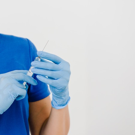 Woman holding syringeの写真素材